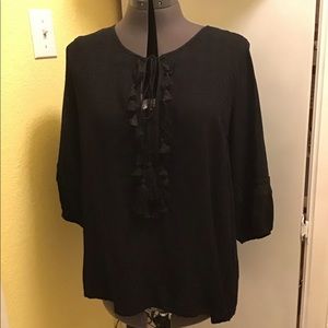 Black top with front tassels and tie.